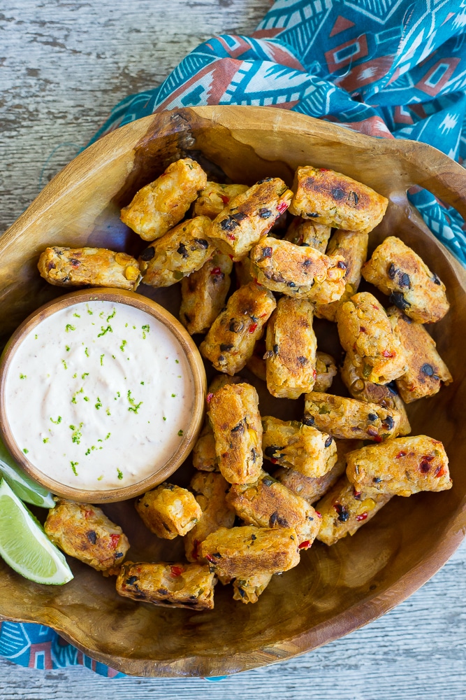 Tex Mex Tater Tots with Creamy Chipotle Lime Dip- Baked to perfection for a healthy and flavorful side dish! Dipped into a creamy and tangy dip! You'll never buy frozen tater tots again after you make your own! Gluten free, vegetarian