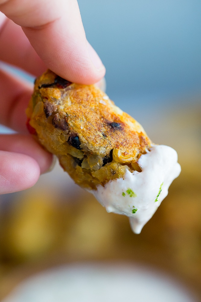 Tex Mex Tater Tots with Creamy Chipotle Lime Dip- Baked to perfection for a healthy and flavorful side dish! Dipped into a creamy and tangy dip! You'll never buy frozen tater tots again after you make your own! Gluten free, vegetarian