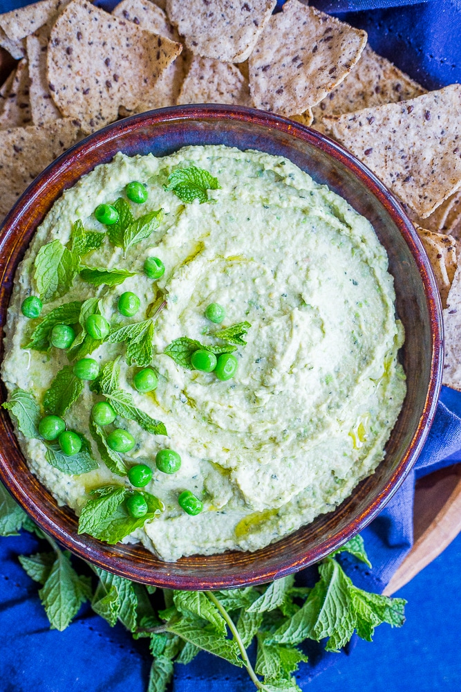 Minty Sweet Pea Hummus - A fresh and flavorful twist on the classic!  Great for a healthy appetizer, snack or to put on sandwiches and salads!  Gluten free, vegan, healthy