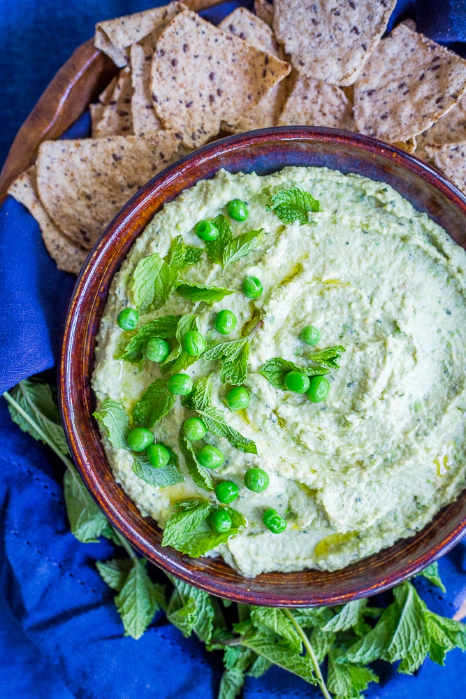 Minty Sweet Pea Hummus - A fresh and flavorful twist on the classic!  Great for a healthy appetizer, snack or to put on sandwiches and salads!  Gluten free, vegan, healthy