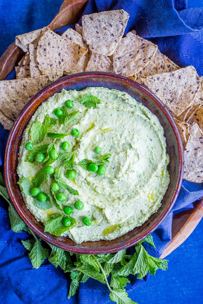 Minty Sweet Pea Hummus - A fresh and flavorful twist on the classic!  Great for a healthy appetizer, snack or to put on sandwiches and salads!  Gluten free, vegan, healthy