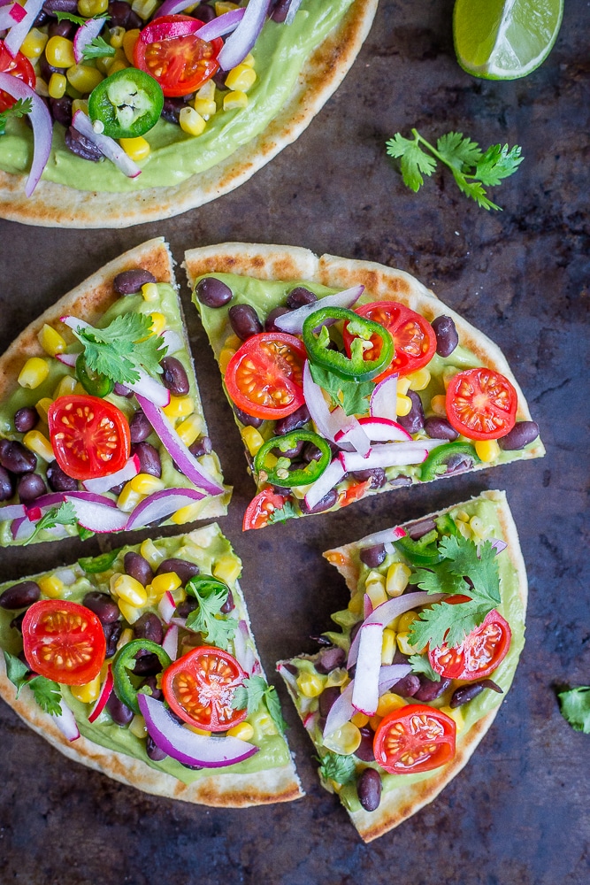 Guacamole Pita Pizzas- A delicious and easy 20 minute vegan no cook dinner that is packed with lots of healthy vegetables!
