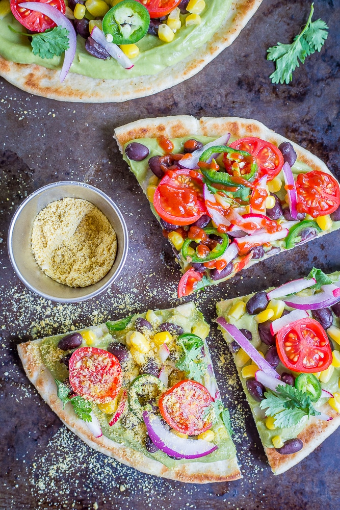 Guacamole Pita Pizzas- A delicious and easy 20 minute vegan no cook dinner that is packed with lots of healthy vegetables!