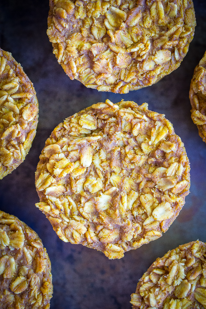 flat lay photo of pumpkin baked oatmeal cups on a baking sheet