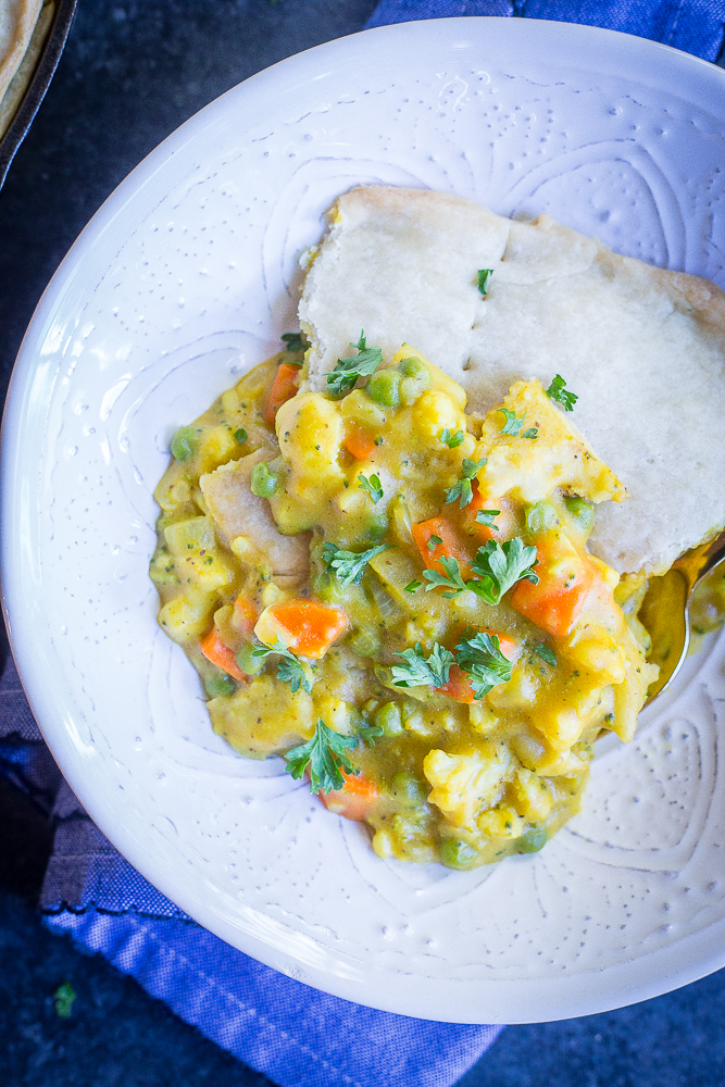 This Curried Vegetable Pot Pie is such a delicious and flavorful vegan comfort food dish! It's rich and decedent but also packed with veggies making it a healthier option! Great for dinner! #vegan #vegetarian #dinner #comfortfood #potpie