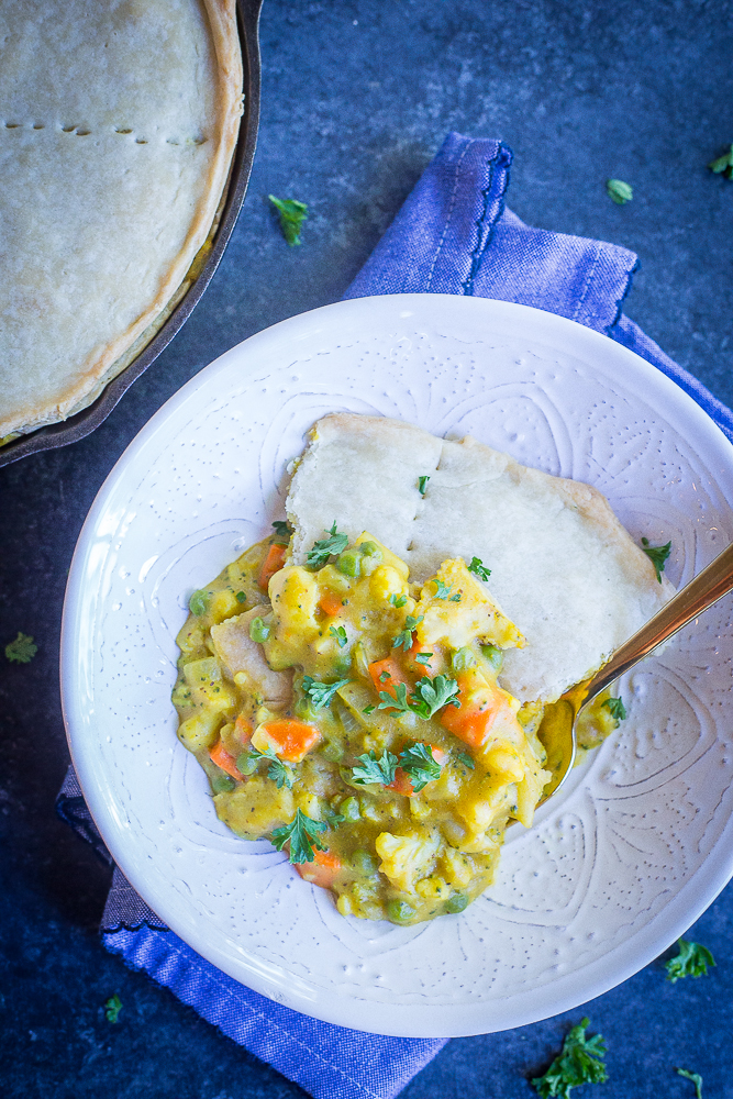 This Curried Vegetable Pot Pie is such a delicious and flavorful vegan comfort food dish! It's rich and decedent but also packed with veggies making it a healthier option! Great for dinner! #vegan #vegetarian #dinner #comfortfood #potpie