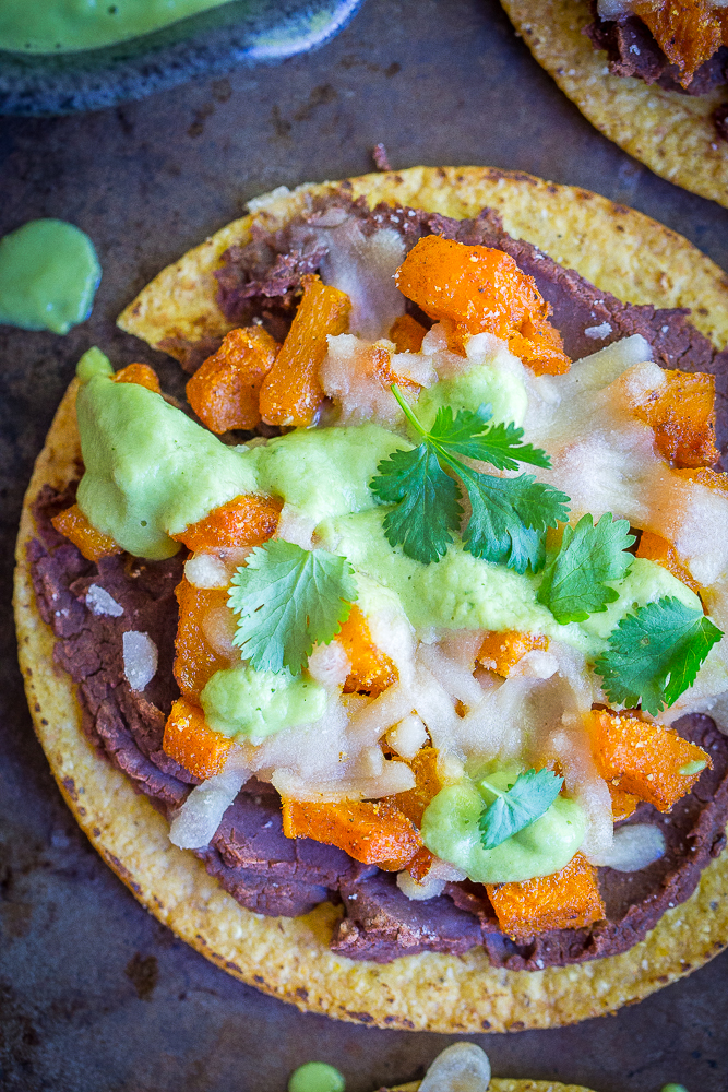 These Roasted Butternut Squash Tostadas with Avocado Lime Sauce are a really delicious easy dinner! They're healthy, vegan and gluten free! A perfect Mexican inspired fall dinner!