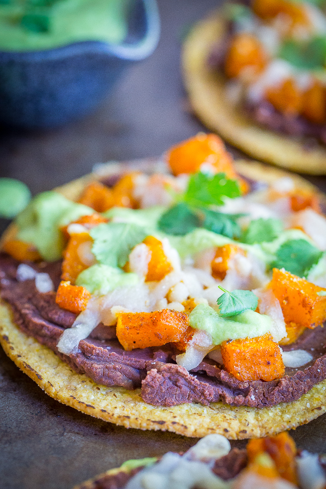 These Roasted Butternut Squash Tostadas with Avocado Lime Sauce are a really delicious easy dinner! They're healthy, vegan and gluten free! A perfect Mexican inspired fall dinner!