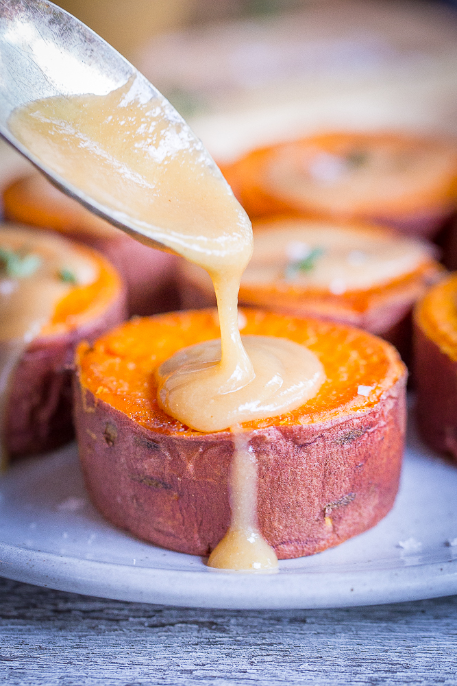 Roasted Sweet Potatoes with Tahini Maple Butter - These delicious and decedent sweet potatoes are so easy to make and are delicious as a side dish or snack! They're also vegan and gluten free!