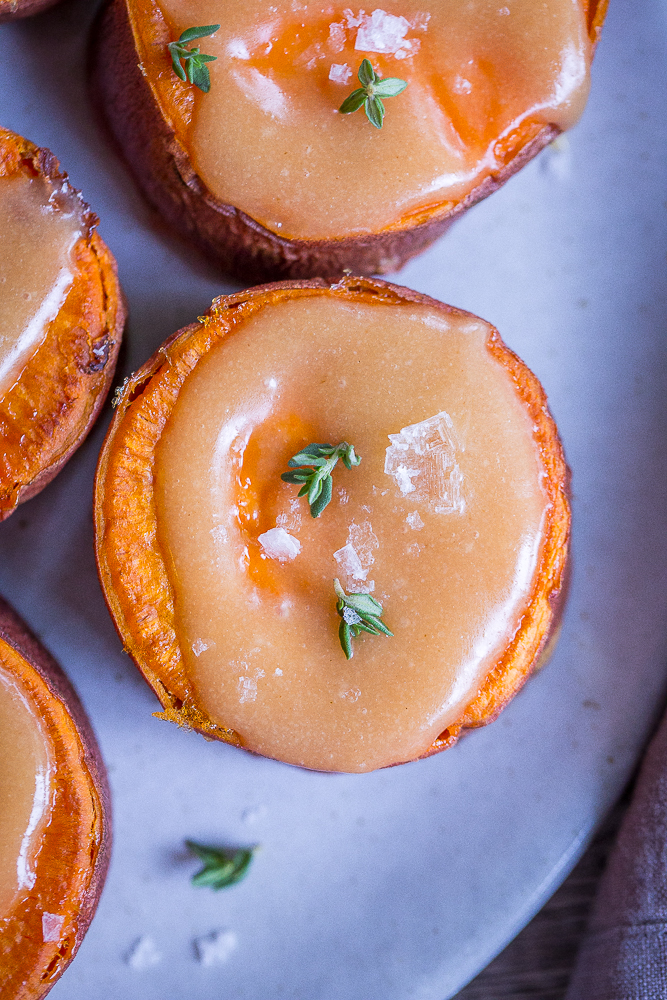 Roasted Sweet Potatoes with Tahini Maple Butter - These delicious and decedent sweet potatoes are so easy to make and are delicious as a side dish or snack! They're also vegan and gluten free!