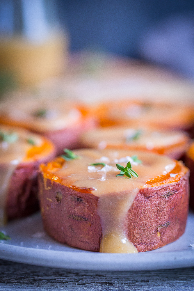 Roasted Sweet Potatoes with Tahini Maple Butter - These delicious and decedent sweet potatoes are so easy to make and are delicious as a side dish or snack! They're also vegan and gluten free!