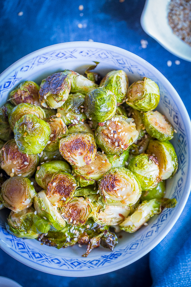 These Maple Sesame Ginger Roasted Brussels Sprouts are full of flavor and will be the perfect side dish for your holiday table! They'll turn everyone into Brussels sprout lovers! Gluten free and vegan
