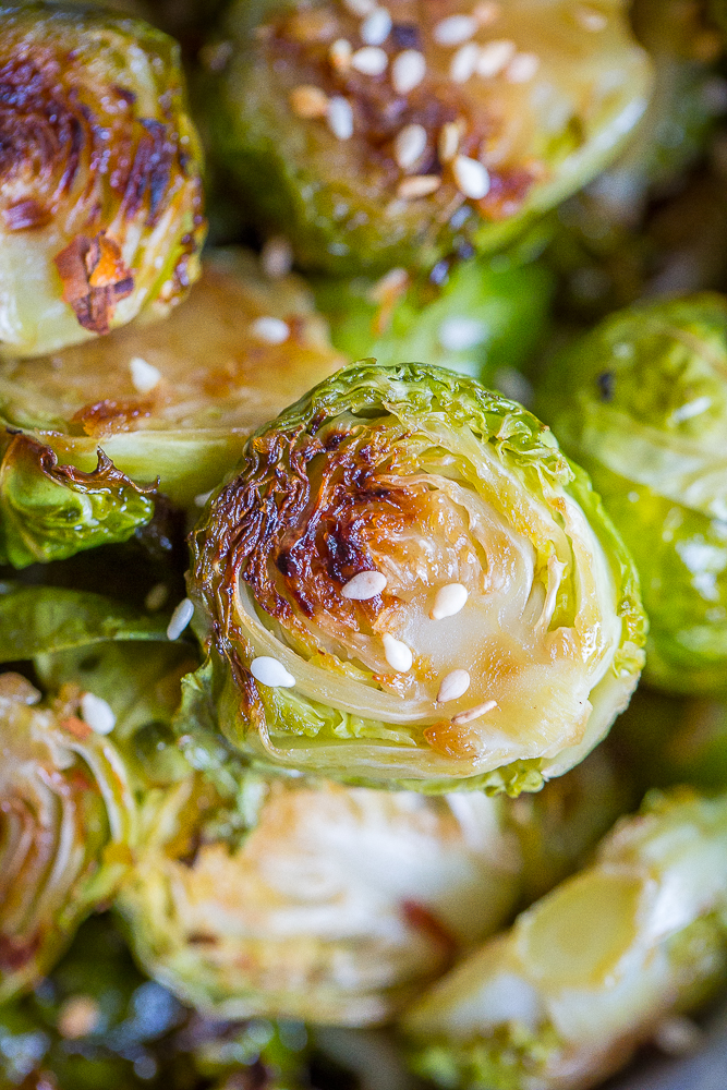 These Maple Sesame Ginger Roasted Brussels Sprouts are full of flavor and will be the perfect side dish for your holiday table! They'll turn everyone into Brussels sprout lovers! Gluten free and vegan