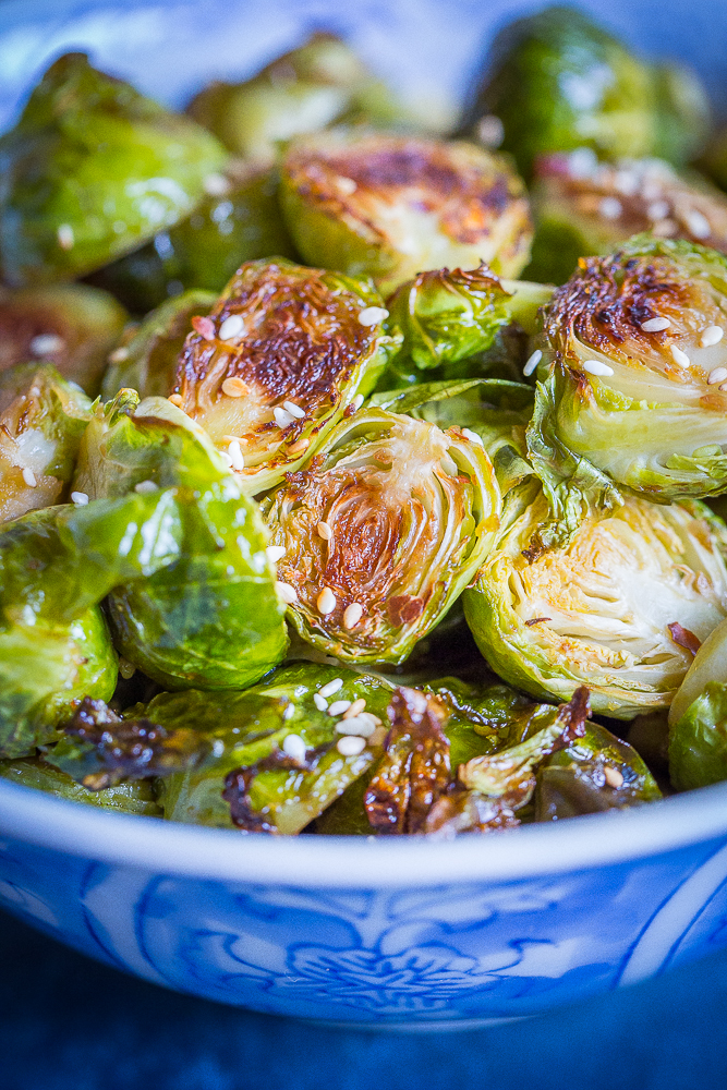 These Maple Sesame Ginger Roasted Brussels Sprouts are full of flavor and will be the perfect side dish for your holiday table! They'll turn everyone into Brussels sprout lovers! Gluten free and vegan