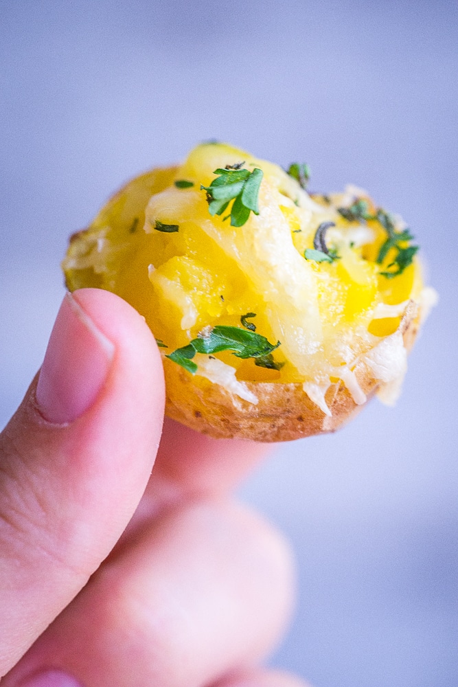 These Garlic and Herb Twice Baked Baby Potatoes are such a delicious and flavorful appetizer! They're perfect for the holidays and naturally gluten free!