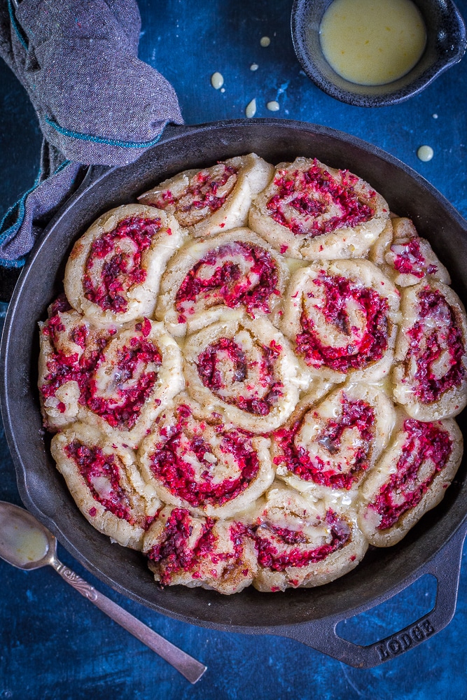 a pan of gluten free cranberry orange cinnamon rolls