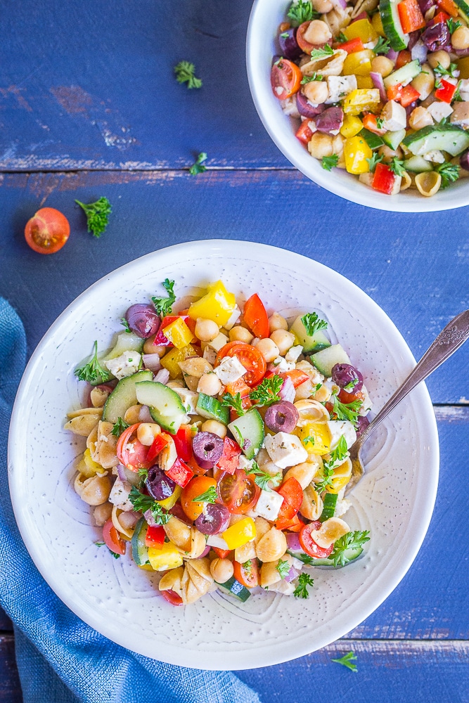 This Loaded Greek Pasta Salad is filled with lots of vegetables and protein! It's a delicious and healthy meal that can be eaten as a lunch or dinner. It's also vegan and gluten free!