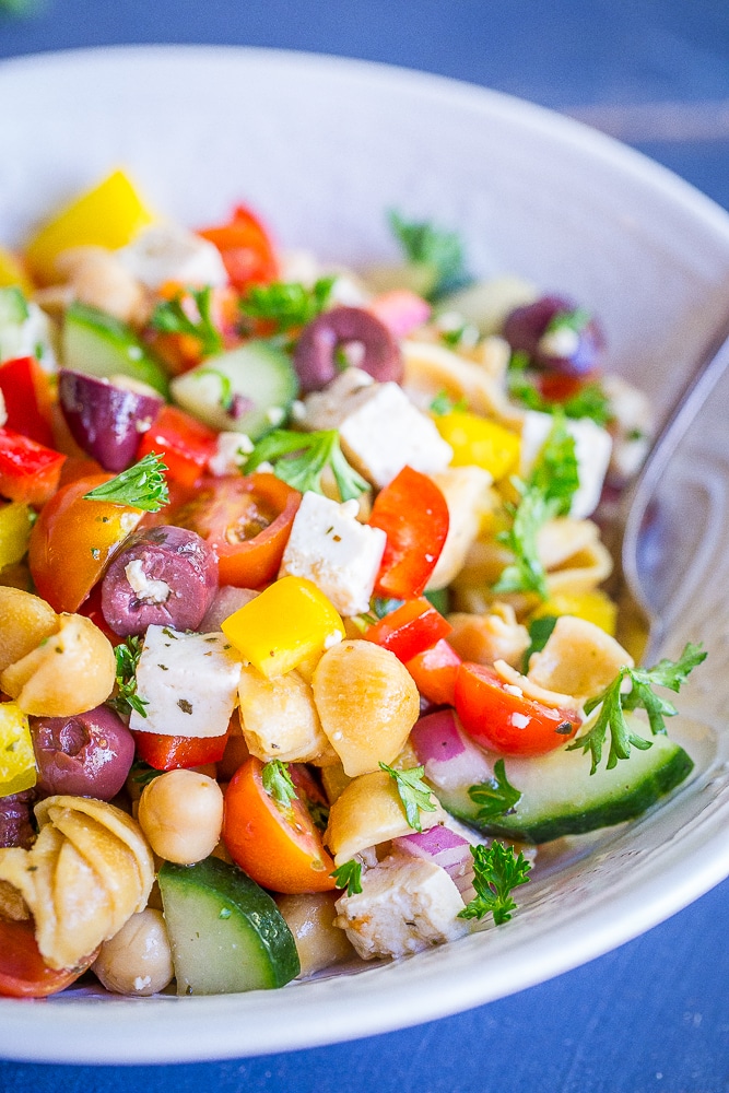 This Loaded Greek Pasta Salad is filled with lots of vegetables and protein! It's a delicious and healthy meal that can be eaten as a lunch or dinner. It's also vegan and gluten free!