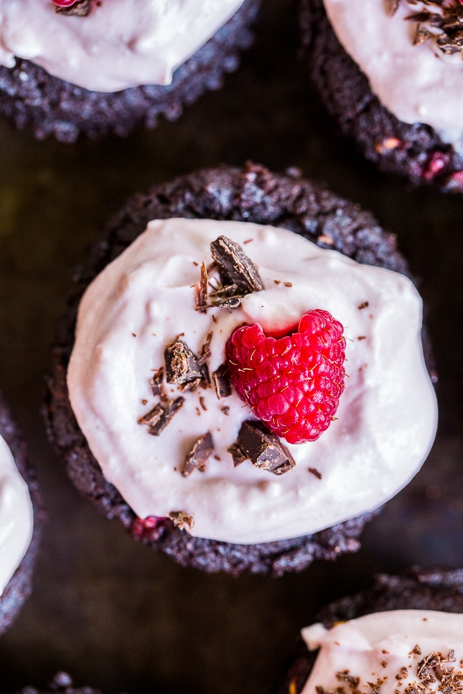 These Healthier Chocolate Cupcakes with Raspberries are made with healthy ingredients and packed with raspberries and beets to make the extra nutritious! They're also vegan, gluten free and refined sugar free! Perfect for dessert and great to bring to parties!