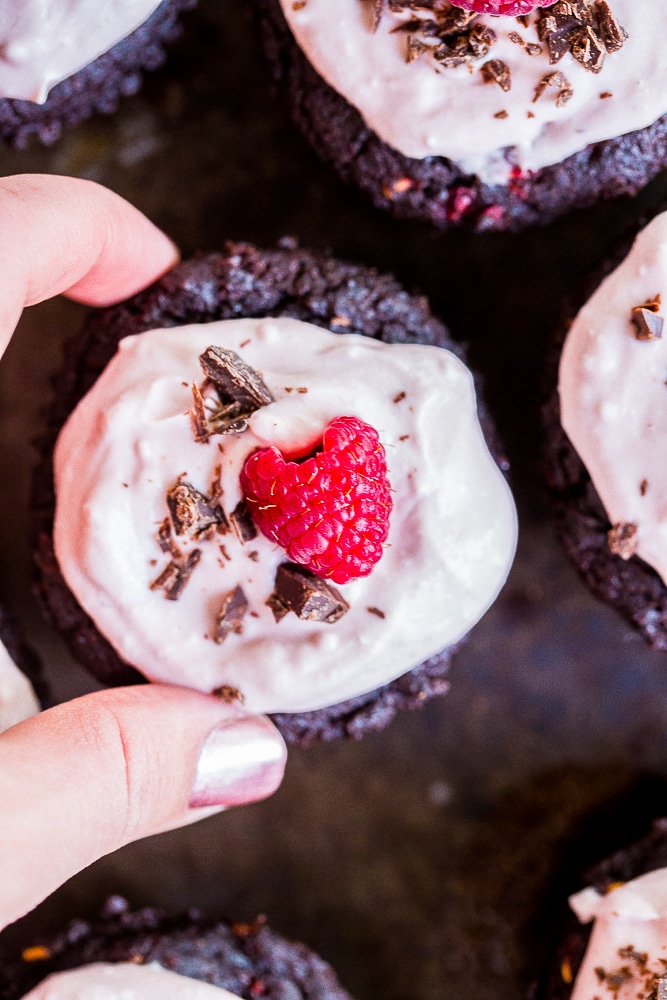 These Healthier Chocolate Cupcakes with Raspberries are made with healthy ingredients and packed with raspberries and beets to make the extra nutritious! They're also vegan, gluten free and refined sugar free! Perfect for dessert and great to bring to parties!