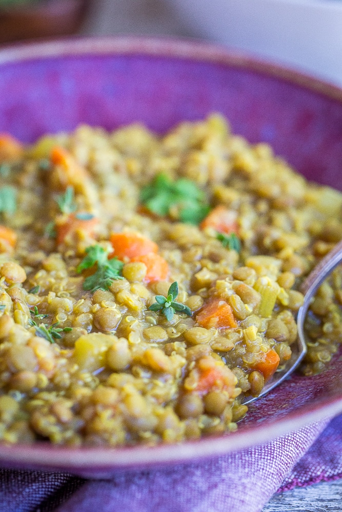 This Curried Lentil Quinoa Soup is so hearty and filing! It's made super flavorful with the curry powder and perfect for a comforting dinner or lunch! Naturally gluten free and vegan!