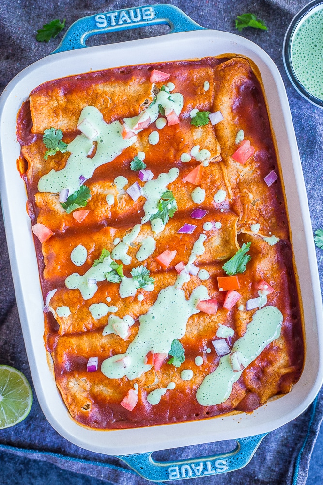 These Easy Spaghetti Squash and Black Bean Enchiladas are packed with flavor and so filling! They're made with roasted spaghetti squash, refried black beans and veggies. These delicious enchiladas are perfect for dinner and can easily be made ahead! Naturally gluten free and vegetarian!