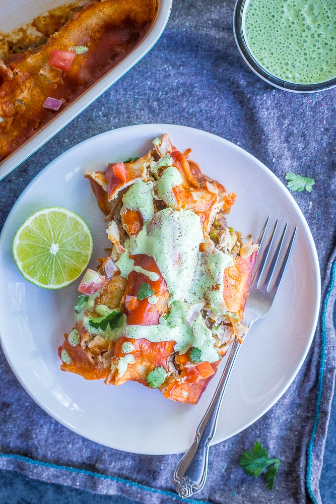 These Easy Spaghetti Squash and Black Bean Enchiladas are packed with flavor and so filling! They're made with roasted spaghetti squash, refried black beans and veggies. These delicious enchiladas are perfect for dinner and can easily be made ahead! Naturally gluten free and vegetarian!