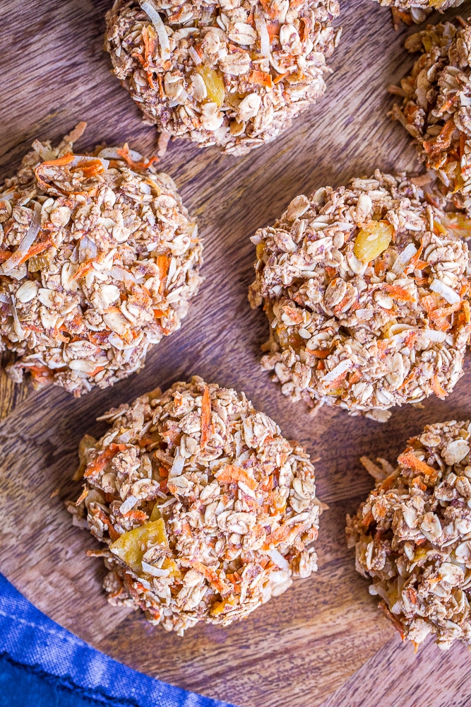 These Healthy Carrot Cake Breakfast Cookies are perfect for an easy make ahead breakfast or snack! They're packed with lots of carrots, coconut and pineapple and filled with lots of warm spices! They're gluten free, vegan and refined sugar free too!