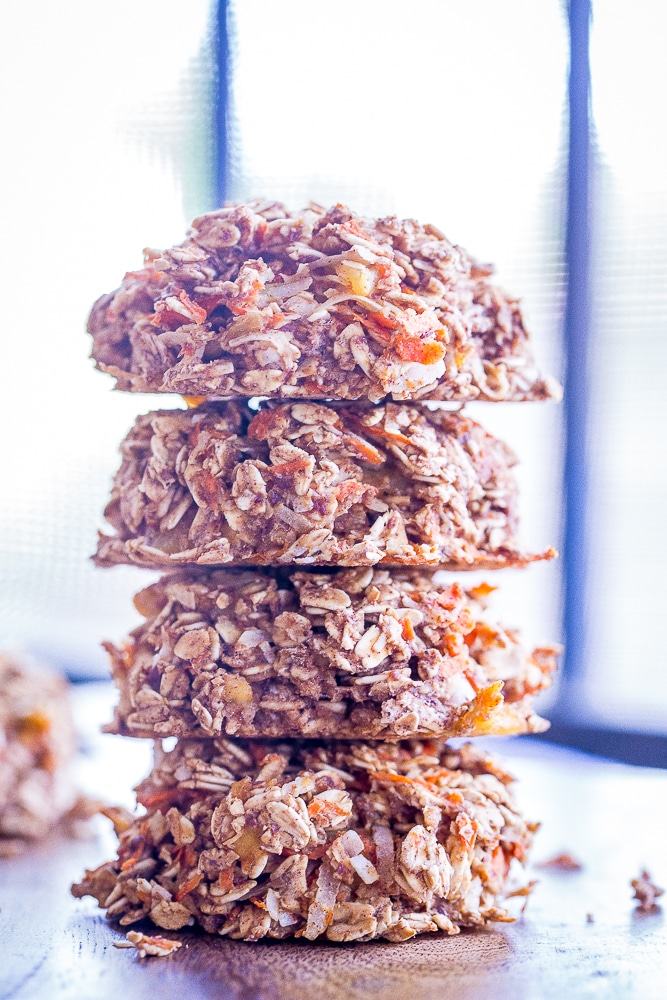 These Healthy Carrot Cake Breakfast Cookies are perfect for an easy make ahead breakfast or snack! They're packed with lots of carrots, coconut and pineapple and filled with lots of warm spices! They're gluten free, vegan and refined sugar free too!