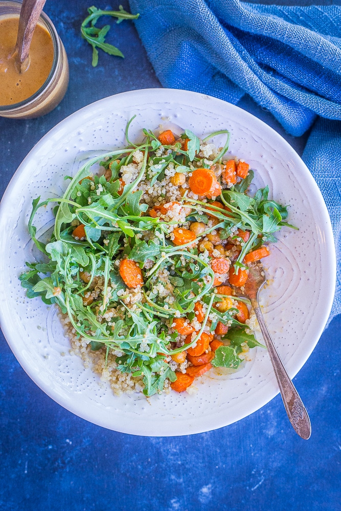 This Roasted Carrot and Chickpea Salad with Orange Ginger Cashew Dressing is such a light and flavorful meal prep lunch recipe! It's loaded with protein and veggies making it filling and healthy! Make it for meal prep or for dinner! Gluten free and vegan!