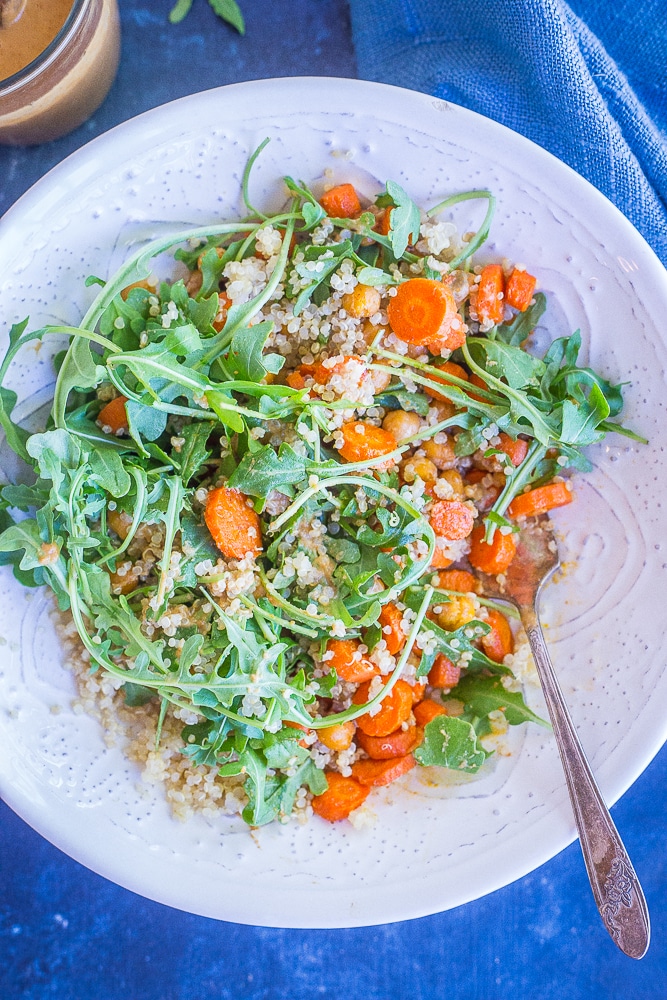 This Roasted Carrot and Chickpea Salad with Orange Ginger Cashew Dressing is such a light and flavorful meal prep lunch recipe! It's loaded with protein and veggies making it filling and healthy! Make it for meal prep or for dinner! Gluten free and vegan!
