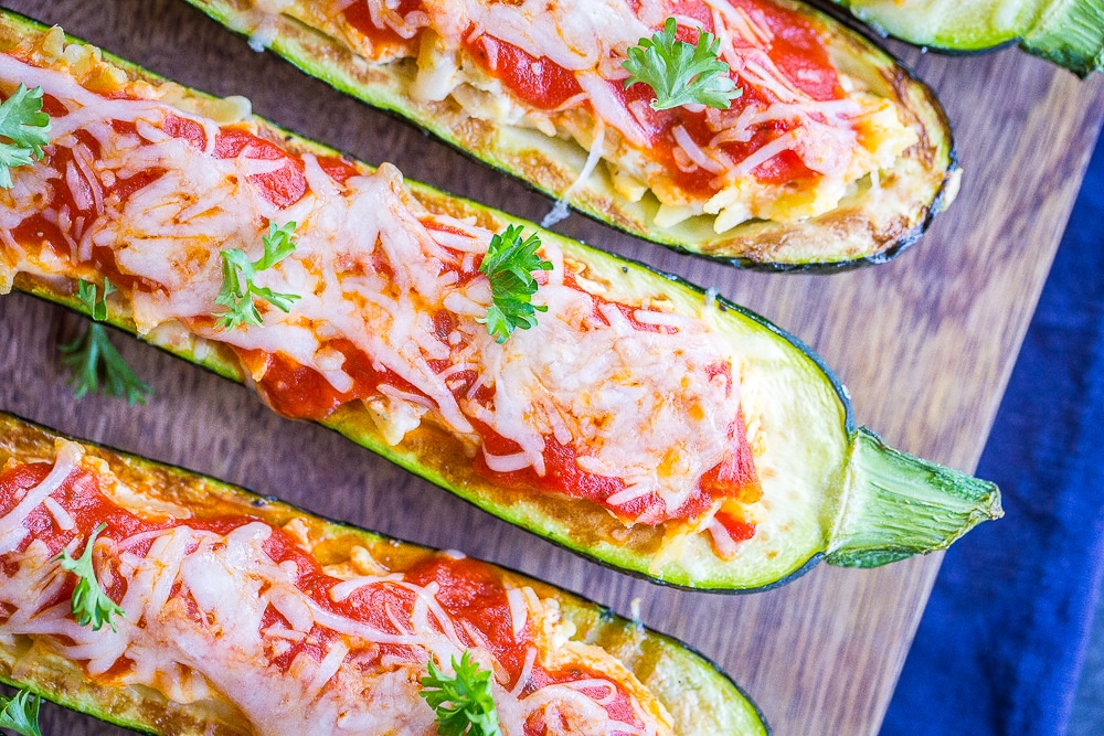 Lasagna Zucchini Boats with Orzo laying on a cutting board