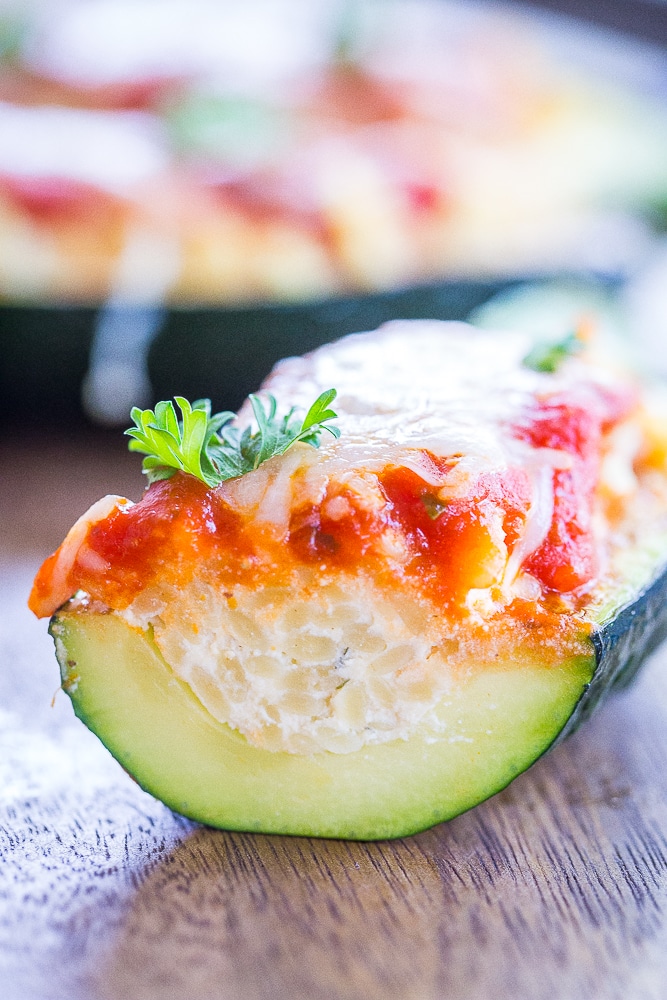 Lasagna Zucchini Boats with Orzo cut open with view of filling