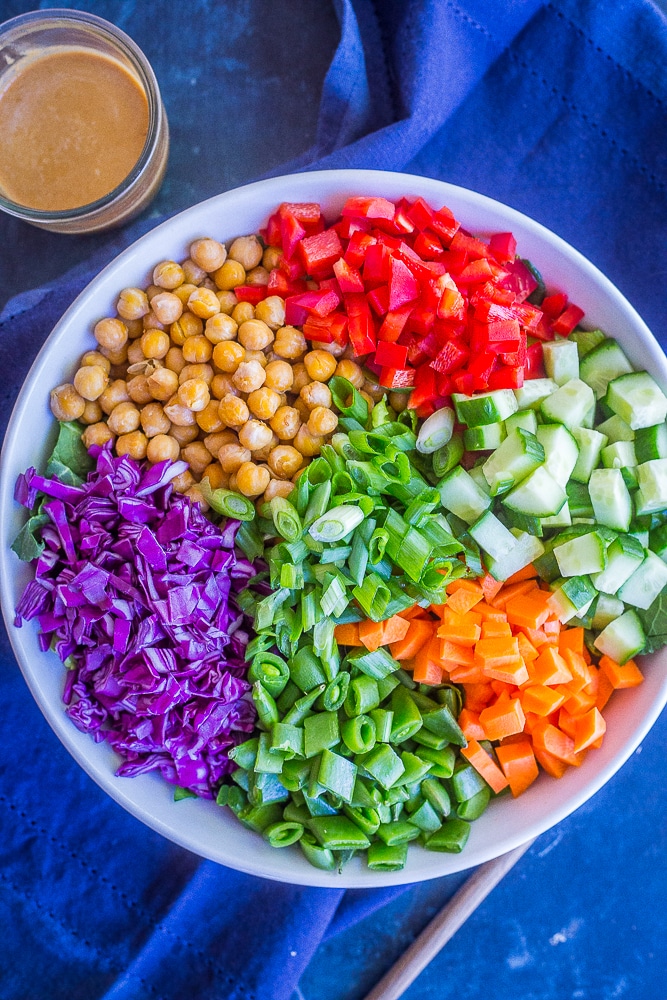 Asian Chickpea Chopped Salad with a napkin and a jar of dressing