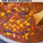 Instant Pot Vegetarian Chili in the instant pot with a wooden spoon