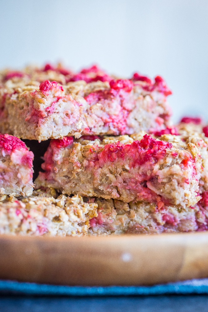 Lemon Raspberry Baked Oatmeal stacked up on a wooden plate