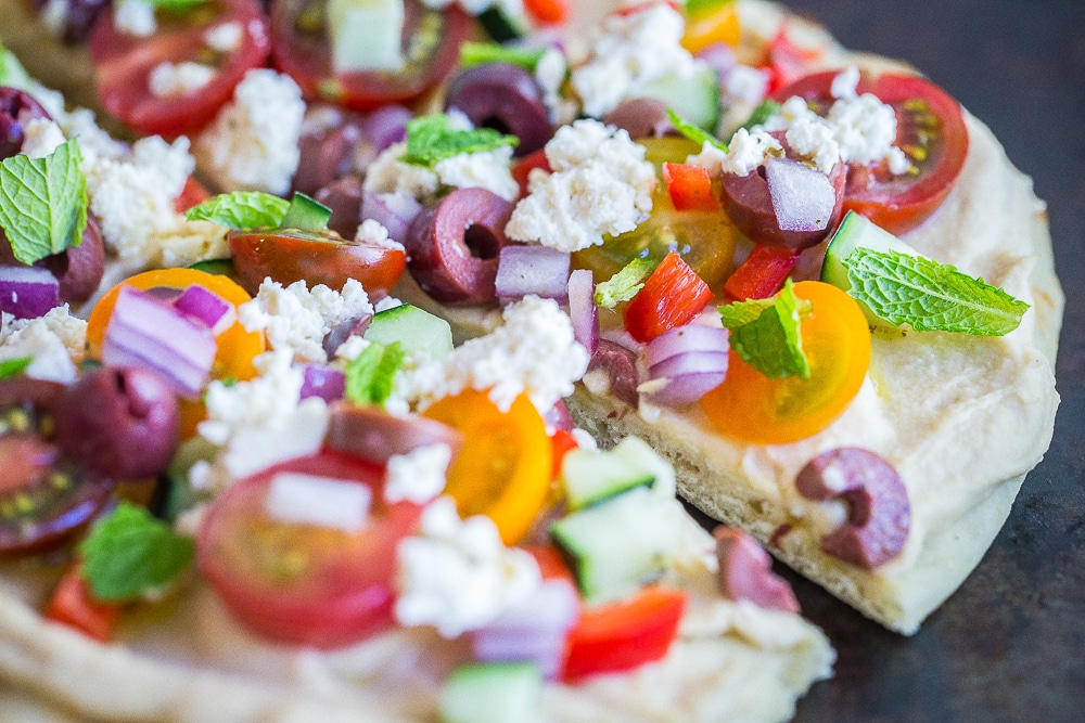 Side view of No Cook Mediterranean Hummus Pizza