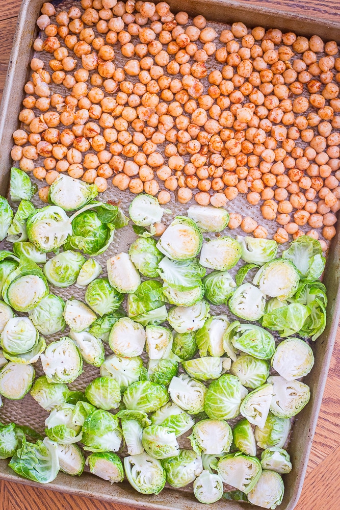 Brussels sprouts and chickpeas on a sheet pan for my Roasted Brussels sprout and Chickpea Meal Prep Bowls