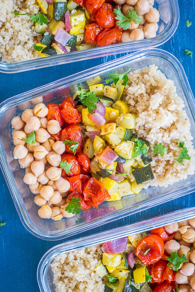 Roasted Summer Vegetable Meal Prep Bowls next to each other on a blue background.