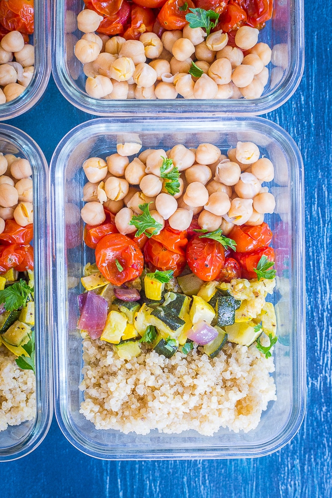 Roasted Summer Vegetable Meal Prep Bowls next to each other on a blue background.