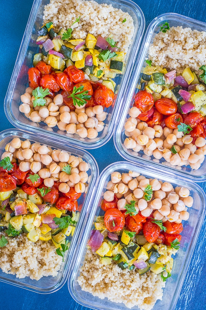 Roasted Summer Vegetable Meal Prep Bowls next to each other on a blue background.