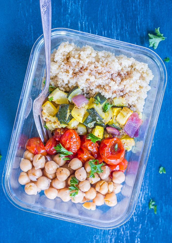 Roasted Summer Vegetable Meal Prep Bowls with dressing and a fork.
