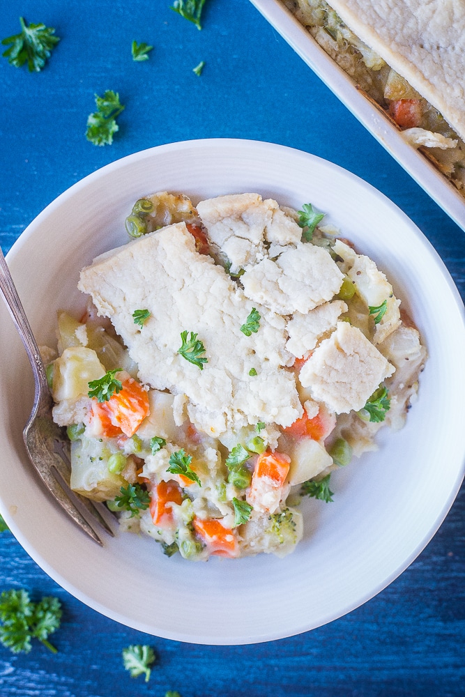 Creamy Vegan Pot Pie in a bowl on a blue background