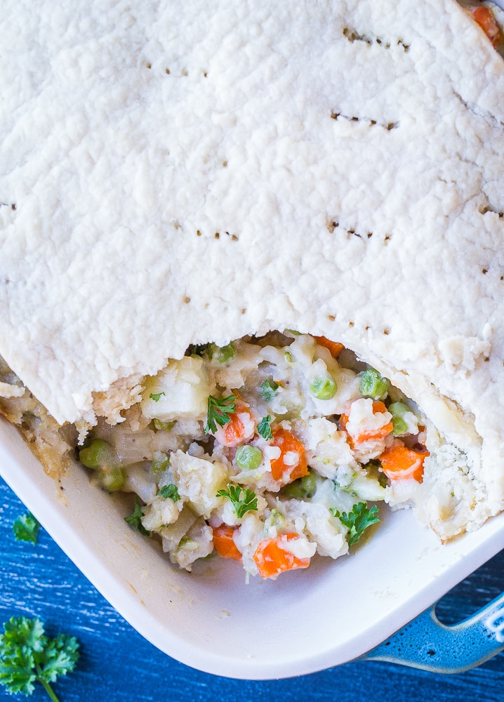 tray of creamy vegan pot pie with a spoonful taken out