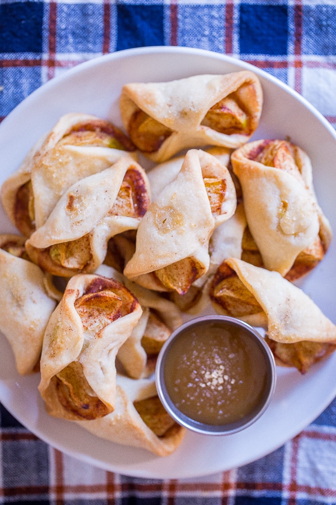 Easy Apple Pie Bites on a plate with caramel sauce