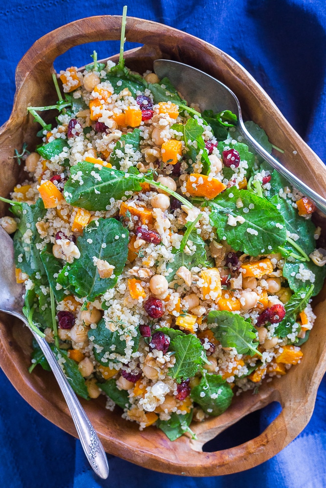 wooden bowl filled with winter quinoa salad with butternut squash
