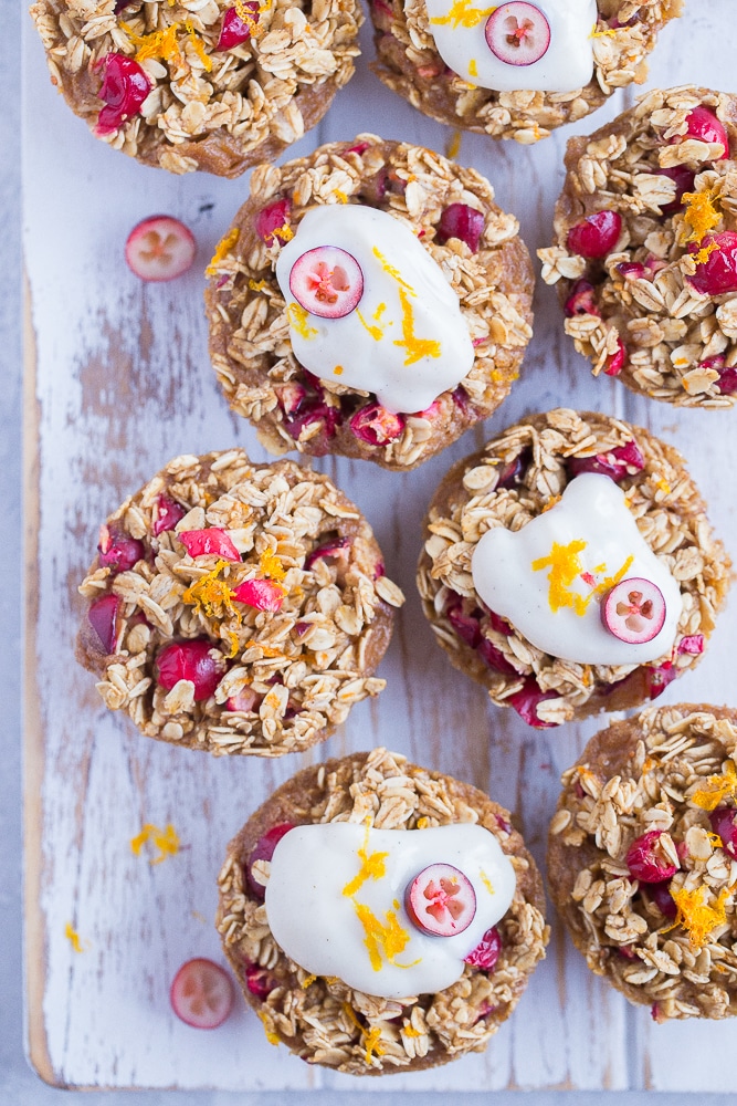 Orange Cranberry Baked Oatmeal Cups on a white background