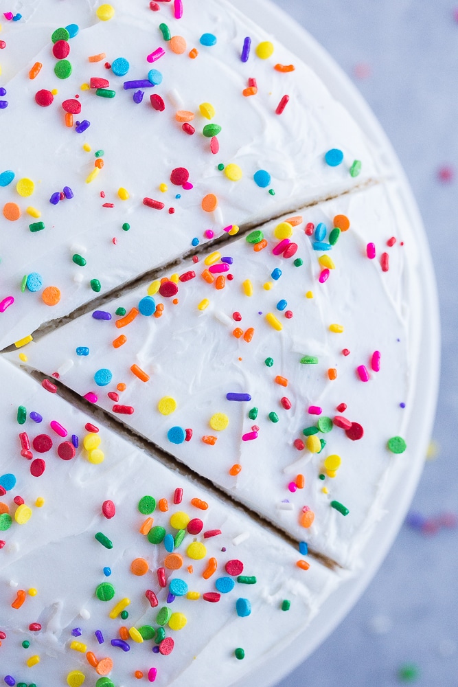 Top view of Best Gluten Free White Cake with a slice cut out of it