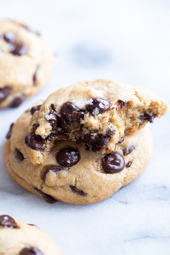 close up of the best vegan chocolate chip cookie with a bite taken out of it