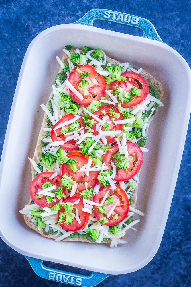 30 Minute Vegetarian French Bread Pizzas with pesto assembled ready to be baked